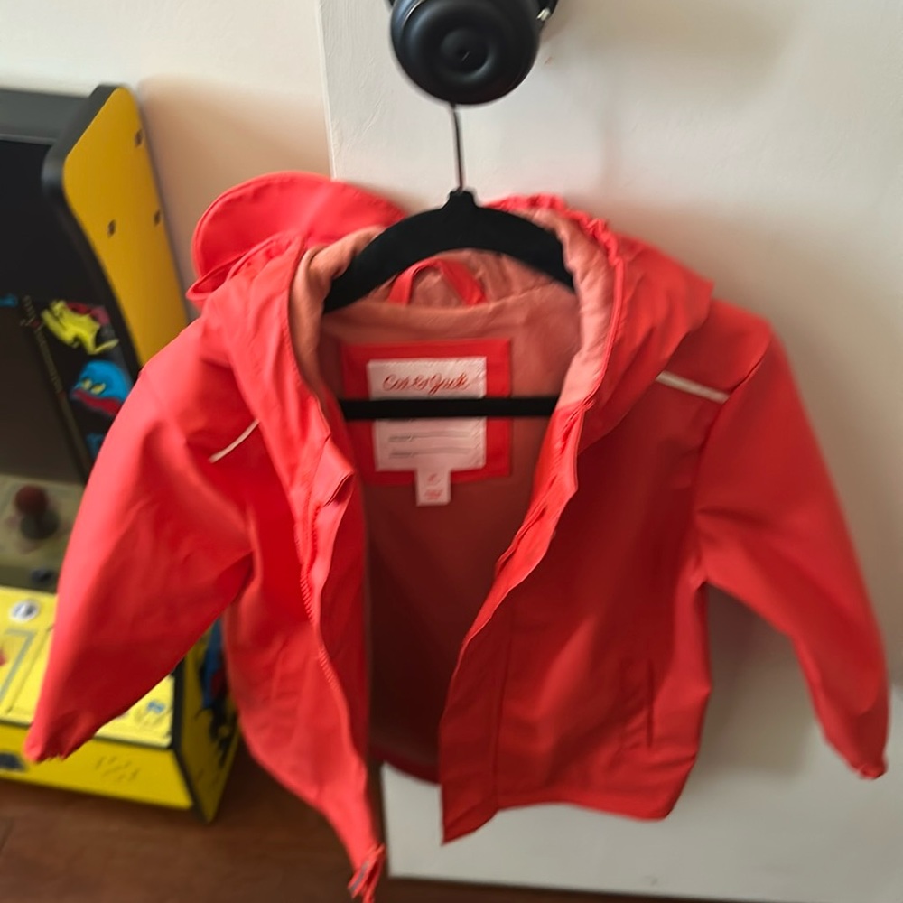 Coral Rain Jacket. Used once. Practically new. No damage. Pet free/smoke free.